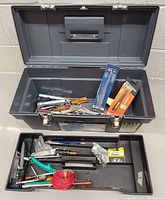 Open mechanics tool box showing assorted tools packed inside including a lift-out tray.