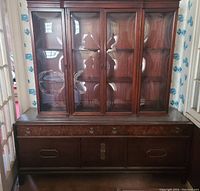 Full front view of the credenza with the bubble glass hutch on top showing the entire piece and its overall condition.