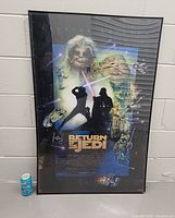 Full view of the large framed Return of the Jedi 1997 special edition poster with prominent characters and space background, next to a soda can for size reference.