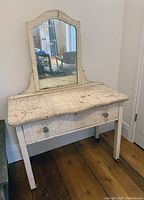 Front view of full vanity table with attached mirror