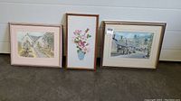 Photo of two vintage framed original art pieces by W. A. Hunt along with one needlepoint piece in middle. Shows framing, overall view of artworks, and vintage condition.