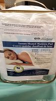 Packaged Beautyrest Luxury Heated Mattress Pad showing size and features.
