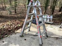 A-frame configuration of the aluminum ladder with orange plastic hinges