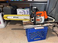 Side view of Stihl 026 chainsaw showing Rollomatic E guide bar in used condition