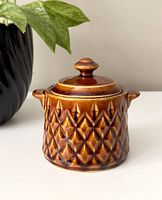 Front view of the brown sugar dish with lid in place, showing diamond pattern and side handles.