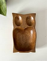 Top view of wooden owl snack tray showing three compartments.