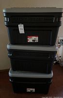 Stack of three Rubbermaid ActionPacker storage boxes showing the front side and lid, demonstrating size and color.