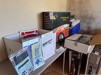 Kit box with decals and instruction displayed on table