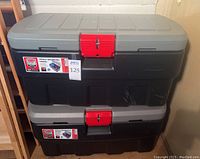 Pair of Rubbermaid Action Packer storage containers stacked one on top of the other showing overall size and color