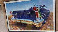 Close-up rear view of the collectible print showing the Oldsmobile car's chrome bumper, tail fins, and taillights in detailed vibrant coloring.