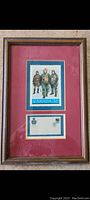 Framed vintage Royal Canadian Air Force memorial stamp and envelope with blue and burgundy mat