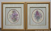 Both vintage floral prints in their gold-toned frames, showing oval artwork and textured mattes