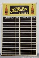 Full front view of antique Nesbitt's Orange soda advertising scoreboard featuring logo and scoreboard slots.