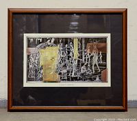 Framed abstract art print titled 'Earth Mother' by David M Manning, showing the full framed artwork with dark brown wood frame and black mat.
