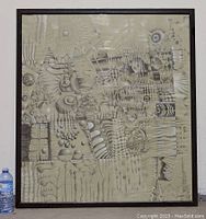 Full view of framed mixed media abstract painting with intricate geometric and organic patterns, framed and standing next to a water bottle for scale.