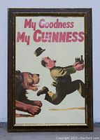 Framed vintage My Goodness My Guinness beer pub poster with a man running from a dog, holding a glass of Guinness. Poster measures 34"x23".
