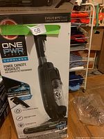 Original product box labeled One PWR System Evolve & Pet Max Cordless Upright Vacuum