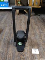 Front view of the black easy pull can crusher showing the handle and crushing mechanism.