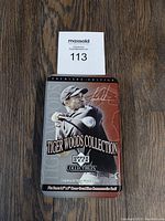 Full view of the Tiger Woods collectible tin from Upper Deck showing the front imagery and text on the lid.