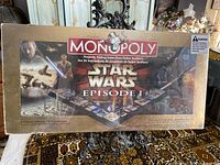 Front view of Monopoly Star Wars Episode I Collector's Edition Board Game in original sealed packaging showing box art with characters and branding.
