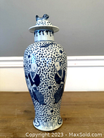 Full front view of vase on table against neutral background