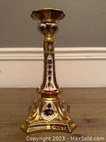 Overall front view of candlestick showing full height and base shape.
