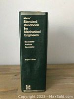 Book spine showing title 'Marks' Standard Handbook for Mechanical Engineers' by Baumeister, Avallone, Baumeister and edition 8th