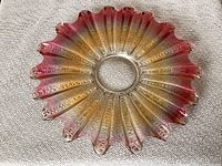 Top view of iridescent star burst platter showing overall shape and color gradient.