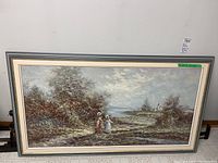 Full view of Marie Charlot landscape oil painting framed, showing coastal scene with two women and village buildings.