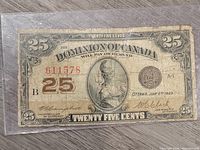 Front side of the 1923 Dominion of Canada 25 cent banknote showing full note, denomination, serial number, and central figure image.