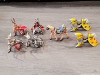 All figures and horses in the lot arranged on a flat surface showing eight Papo toy figures consisting of knights and horses in mismatched pairs