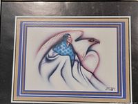 Close-up of unframed Native American print featuring a figure in a blue shawl and an eagle, signed by Robert Redbird.