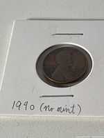 Close-up of 1940 penny obverse side showing Lincoln profile and dated 1940 with no mint mark.