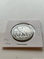 Reverse side of the 1942 Walking Liberty Half Dollar showing an eagle perched on a mountain with inscriptions.