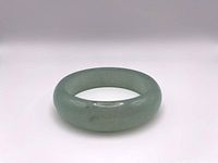 Front view of jade bangle showing overall shape and color