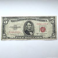 Full front view of the 1953 series $5 U.S. banknote showing Abraham Lincoln portrait, red Treasury seal, and serial numbers.