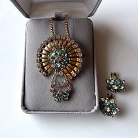 Image of vintage gold filled necklace with rhinestone brooch pendant and matching earrings inside jewelry box