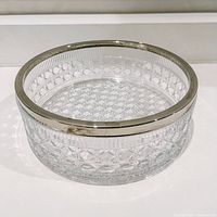 Front angled view showing the crystal cane pattern and silver rim with some tarnish.