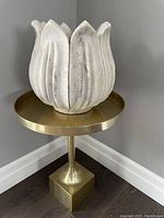 Full assembly showing marble planter on brass stand