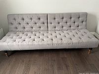 Front view of full sofa in sofa position against wall