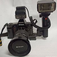 Front view of Nikon N8008 body with 35-70mm lens and dual flashes mounted