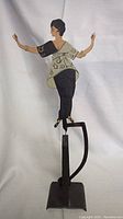 Full view of the pendulum figure dancer showing the figure and the stand