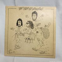 Front cover of 'The Who By Numbers' album showing caricature connect-the-dots illustration of band members.