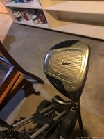 Close-up image of Nike 9.5 degree driver golf club head showing brand and loft detail with wear.
