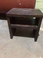 Front and side view of handmade wooden bench or small cabinet showing structure and shelf