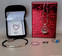 Full lot showing all sterling silver jewellery pieces and red display box.