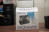 Box of Bionaire Clear Mist 3 Home Humidifier showing brand, model, and specifications including 3-gallon capacity.