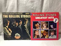 Front covers of two Rolling Stones vinyl LP albums from 1964 and 1977