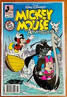 Front cover of Mickey Mouse Adventures #1 comic book showing main characters Mickey and Minnie and the Phantom Gondolier character.