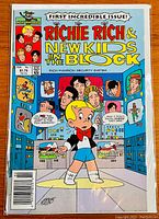 Front cover of comic book showing Richie Rich with New Kids on the Block graphics and title.